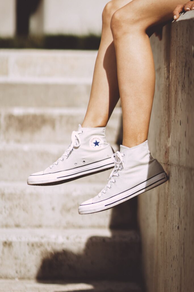 Woman Wearing White High-top Sneakers